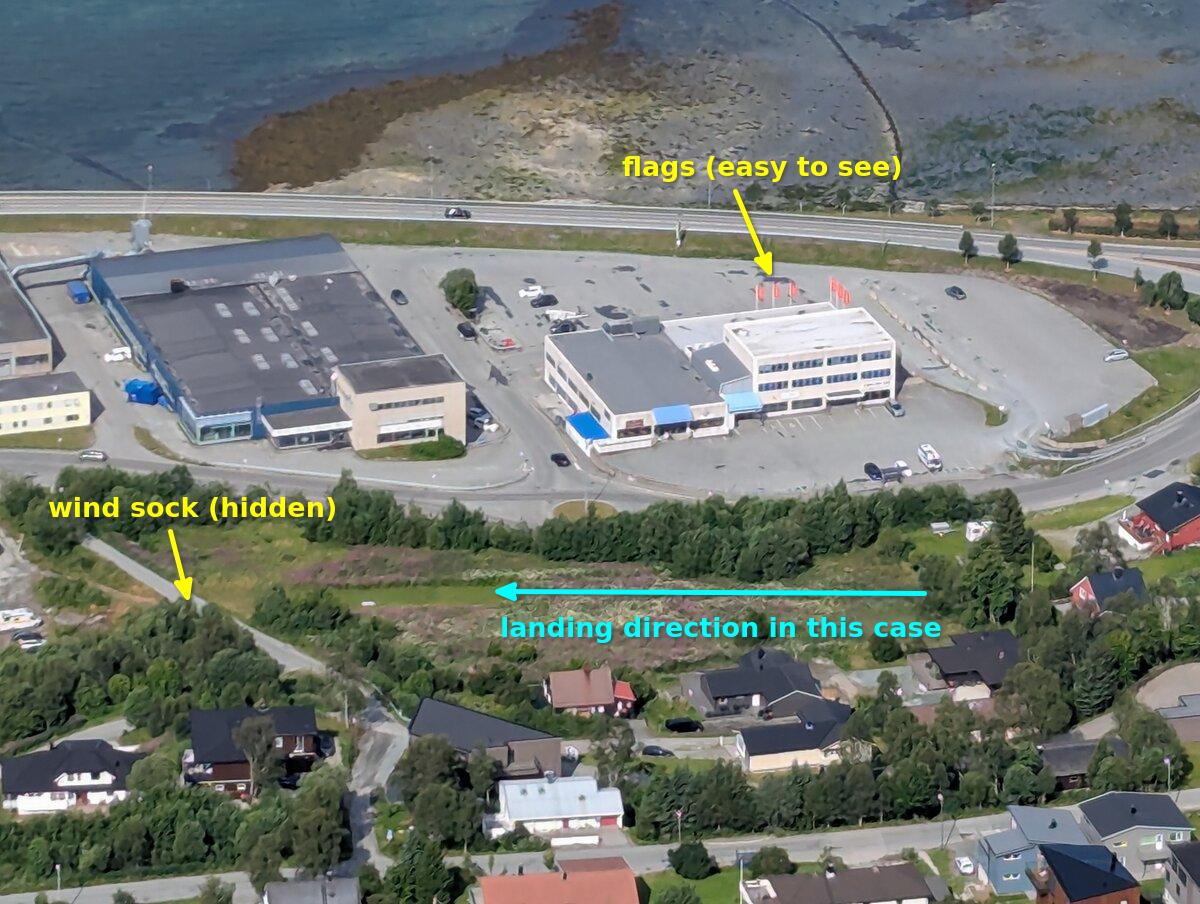 Photo of the TIRB landing indicating where the wind sock is and where to look for wind direction